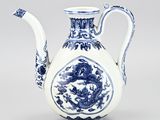 a blue and white vase with a dragon on it