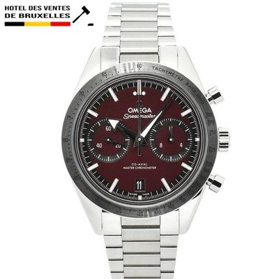 a close up of a wrist watch with a red dial