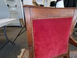 a red chair that is sitting in a room