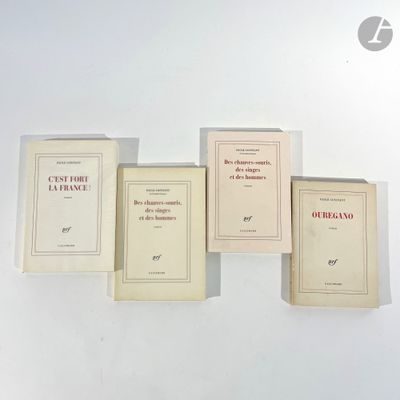 four books on a white table with a white background
