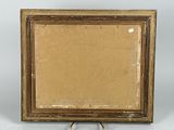 an old picture frame with a picture of a cat on it