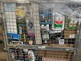 a metal cage with a bunch of items inside of it