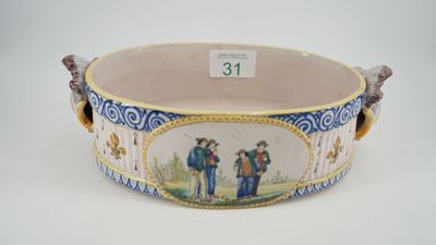 a large blue and white bowl with a painting on it