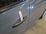 a sticker on the door handle of a car