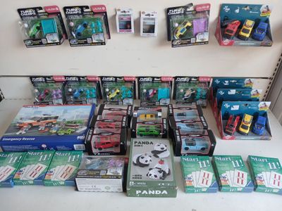 many different kinds of toys on display on the table