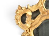 a gold frame with two mirrors on it