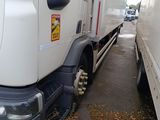 a white truck that is parked next to a white truck