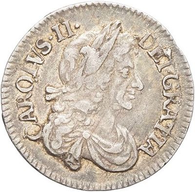 a silver coin with the head of a woman on it
