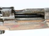 an old gun with a wooden barrel on a white background