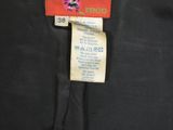 a close up of a black pants with a label on it