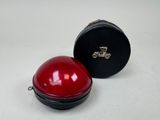 a red light that is sitting next to a black box