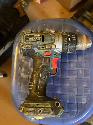 a drill that is sitting on top of a blue chair