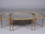 a pair of three tables with mirrored tops and gold leaf bases