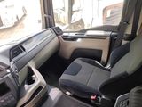 a view of the inside of a vehicle from the driver ' s seat