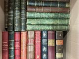 many old books in a box on the shelf
