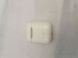 a white apple airpods sitting on a white surface