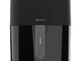 a close up of a black air fryer on a white background