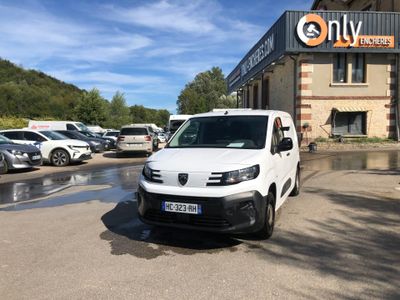 a white van parked in front of a building in a parking lot
