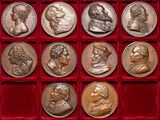 an image of a collection of silver coins in a red case