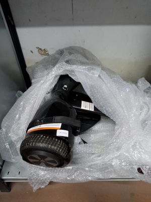 a gas mask that is wrapped in plastic on the floor
