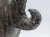 a close up of an old vase on a white background