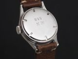 a close up of a wrist watch with a leather strap