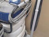 a blue and white vacuum and a blue and white bucket and a blue and white vacuum