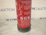 a red fire extinguisor sitting on a table
