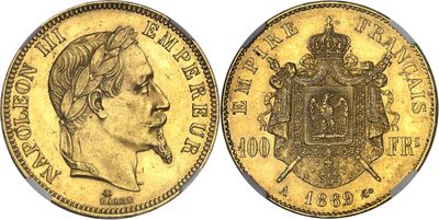 a close up of a gold coin with a crown on it