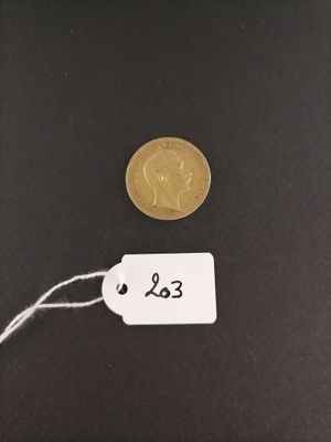 a close up of a coin with a price tag attached to it