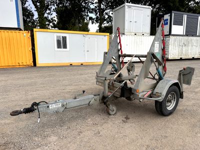 a trailer with a trailer attached to it in a parking lot