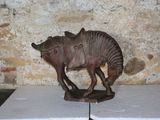 a statue of a horse with a saddle on it ' s back