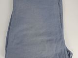 a close up of a pair of blue pants on a white surface