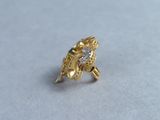 yellow gold ring with a diamond and a flower design