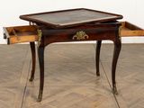 a small table with a drawer on top of it