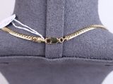 a close up of a necklace on a mannequin with a tag on it
