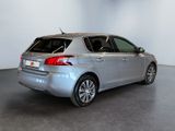 an image of a silver car in a showroom