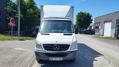 a white van that is parked on the side of the road