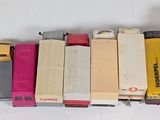 a lot of books that are stacked on top of each other