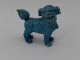 blue dog figurine on white surface with white background