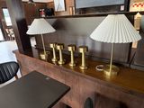 three lamps on a table in a room