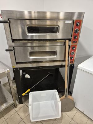 a stack of three ovens sitting next to each other in a kitchen