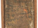 an old picture frame with a rusted surface and rusted paint on it