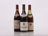three bottles of wine sitting on top of a table next to each other