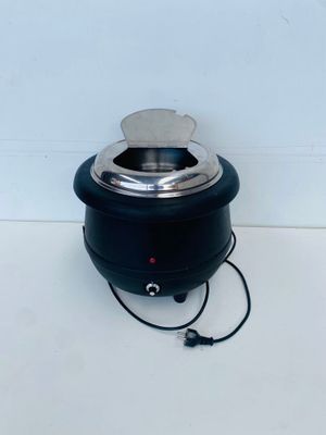 an image of a black electric wax warmer on a white surface