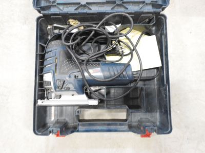 a tool in a case that is sitting on the floor