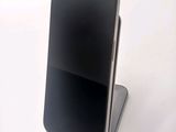 a cell phone that is sitting on top of a stand