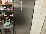 an image of a kitchen with a refrigerator in the corner