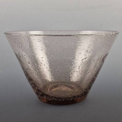 a close up of a glass bowl with water droplets on it