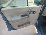a car door open with the driver ' s side door open